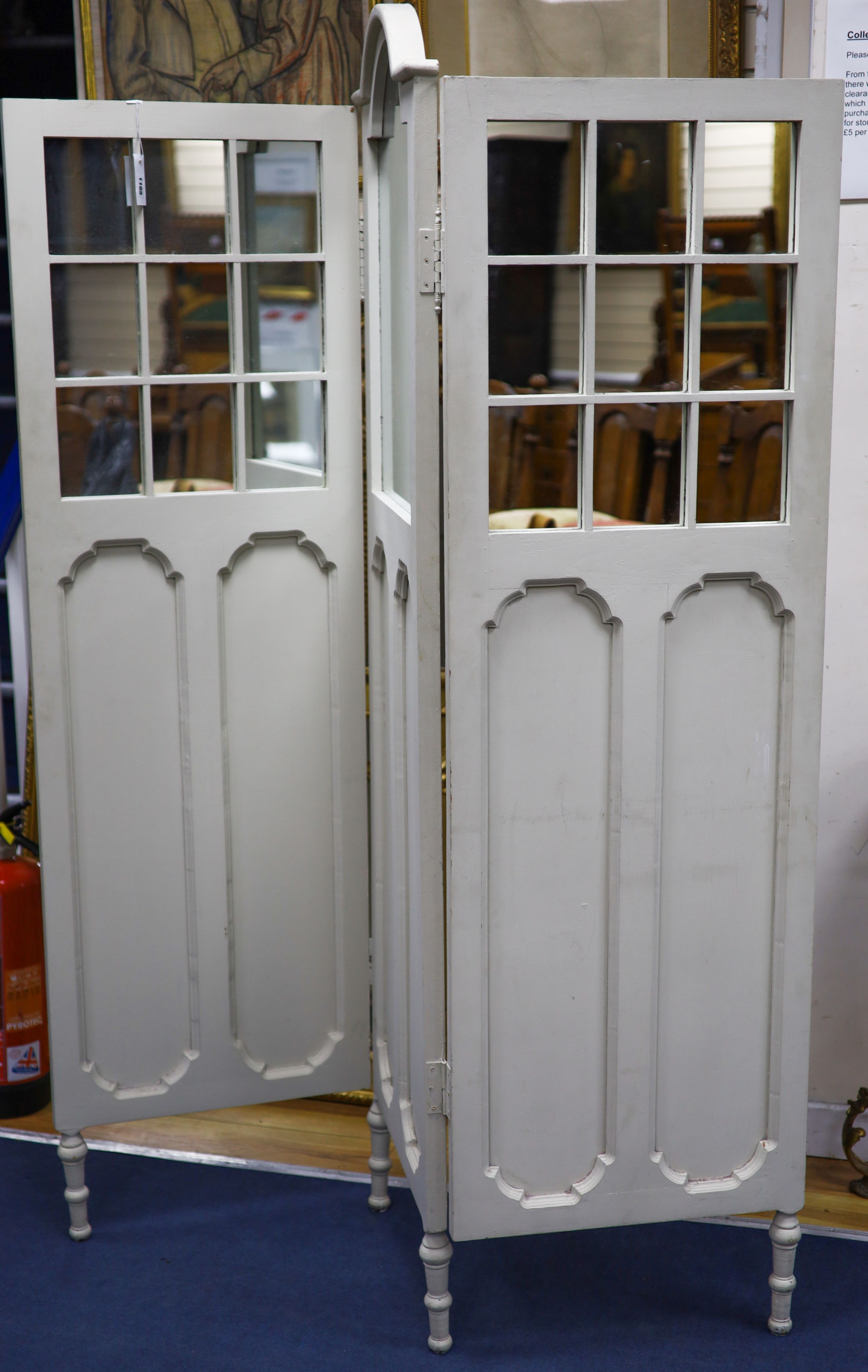 An early 20th century painted mirrored three fold dressing screen, maximum height 185cm